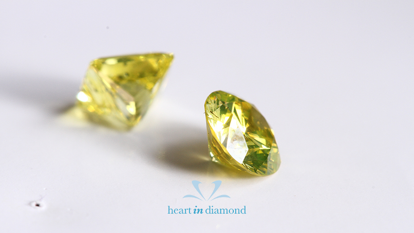 two small yellow diamonds made from coal